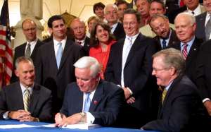 Pennsylvania Gov. Tom Corbett signs the first on-time state budget in eight years on June 20, 2011